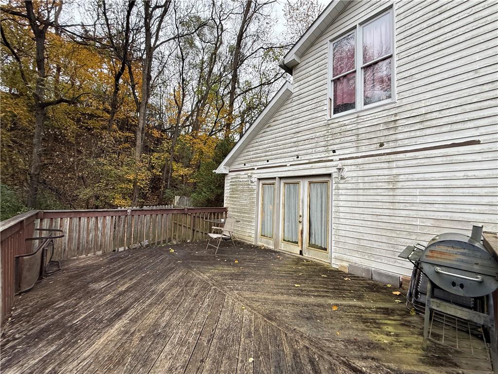 1006-1008 Olive Avenue Natrona Heights, PA 15065 - Photo 23 of 26 a view of a house with a small deck and wooden floor