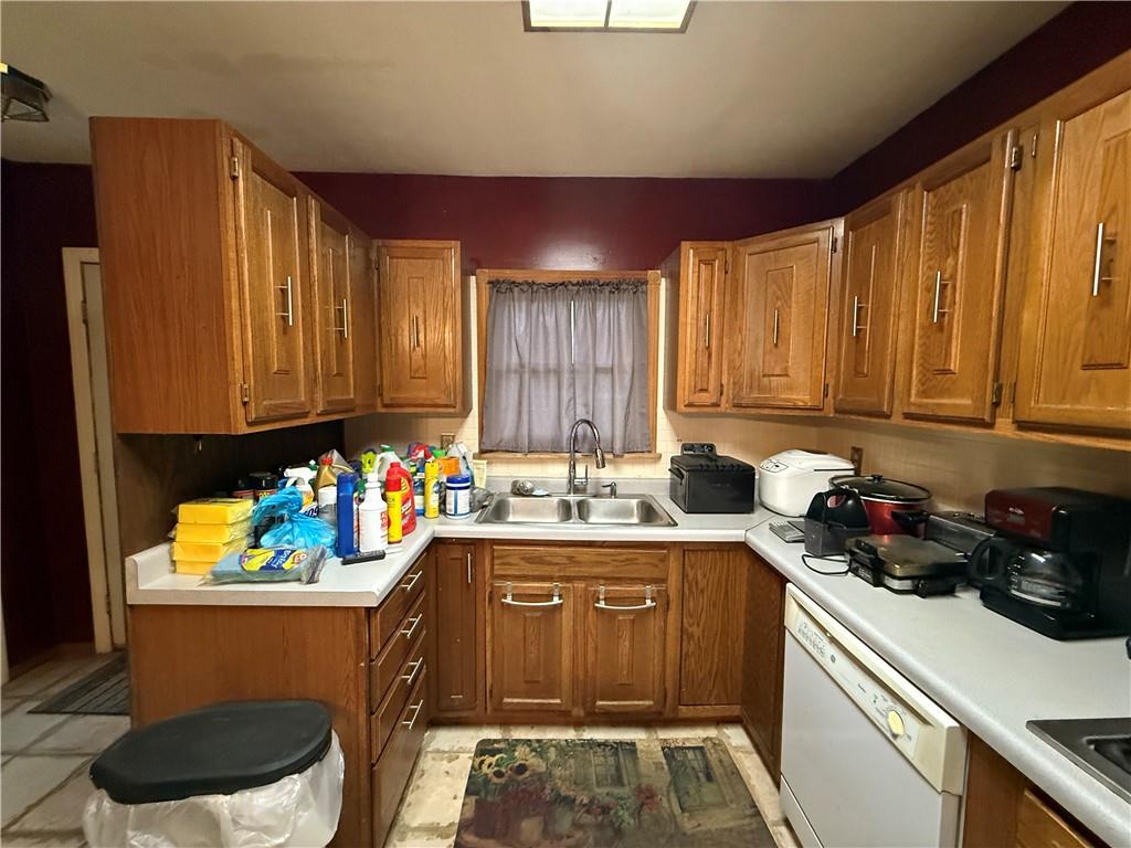 1006-1008 Olive Avenue Natrona Heights, PA 15065 - Photo 5 of 26 a kitchen with a sink a stove cabinets and wooden floor