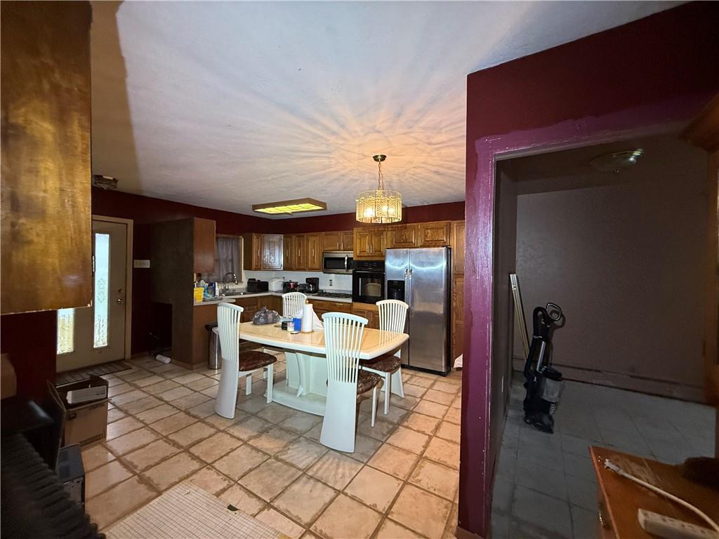 1006-1008 Olive Avenue Natrona Heights, PA 15065 - Photo 8 of 26 a view of a dining room with furniture