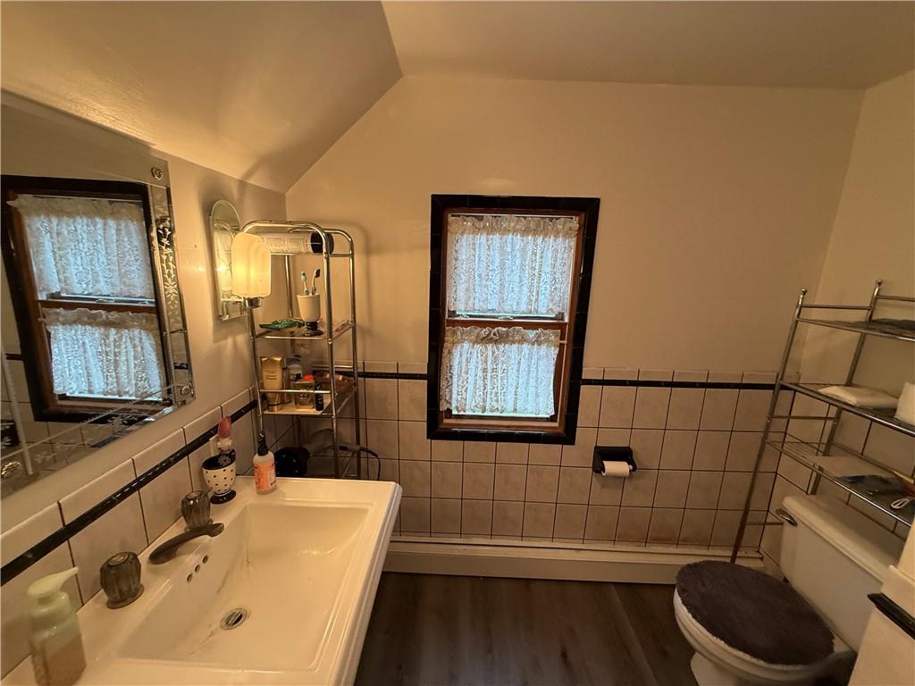 1006-1008 Olive Avenue Natrona Heights, PA 15065 - Photo 10 of 26 a bathroom with a sink a toilet and shower