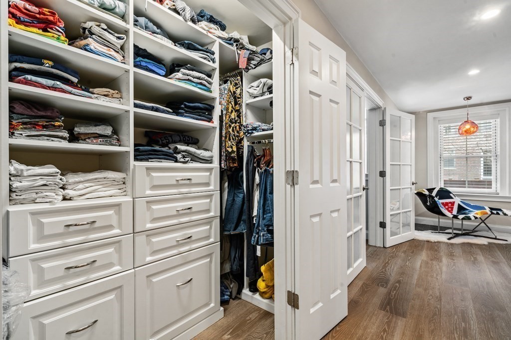 98 Waltham Street, Unit 1 Boston, MA 02118 - Photo 13 of 26 a view of walk in closet with clothes and shoes