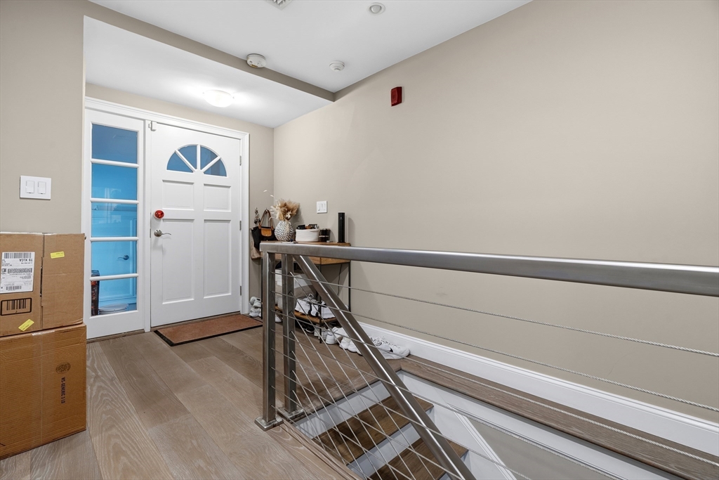 98 Waltham Street, Unit 1 Boston, MA 02118 - Photo 16 of 26 a view of a hallway with workspace