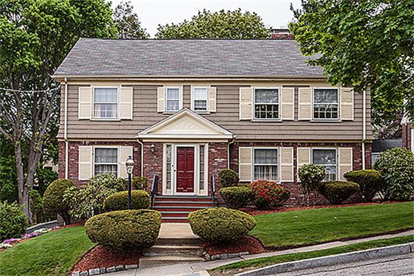 87 Douglas Road Belmont, MA 02478 - Photo 1 of 23 a front view of house with yard and green space