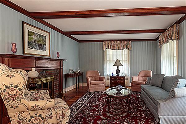 87 Douglas Road Belmont, MA 02478 - Photo 2 of 23 a living room with furniture and a chandelier