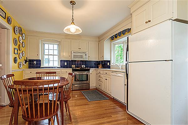 87 Douglas Road Belmont, MA 02478 - Photo 7 of 23 a kitchen with stainless steel appliances granite countertop a refrigerator a stove a sink dishwasher and a refrigerator with wooden floor