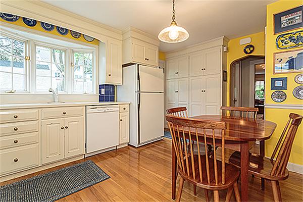 87 Douglas Road Belmont, MA 02478 - Photo 8 of 23 a kitchen that has a table chairs in it and wooden floor