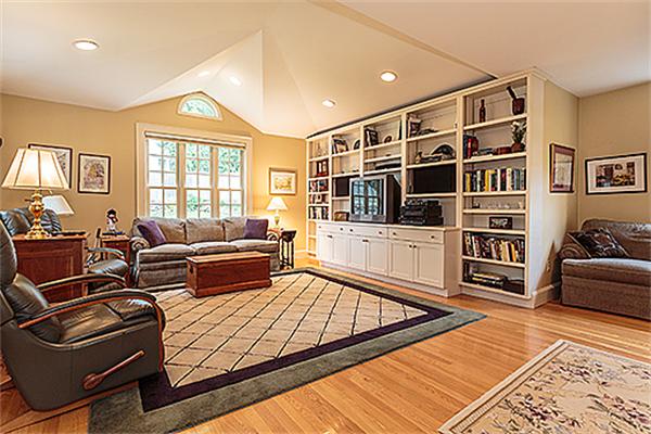87 Douglas Road Belmont, MA 02478 - Photo 9 of 23 a living room with furniture ceiling fan and a window