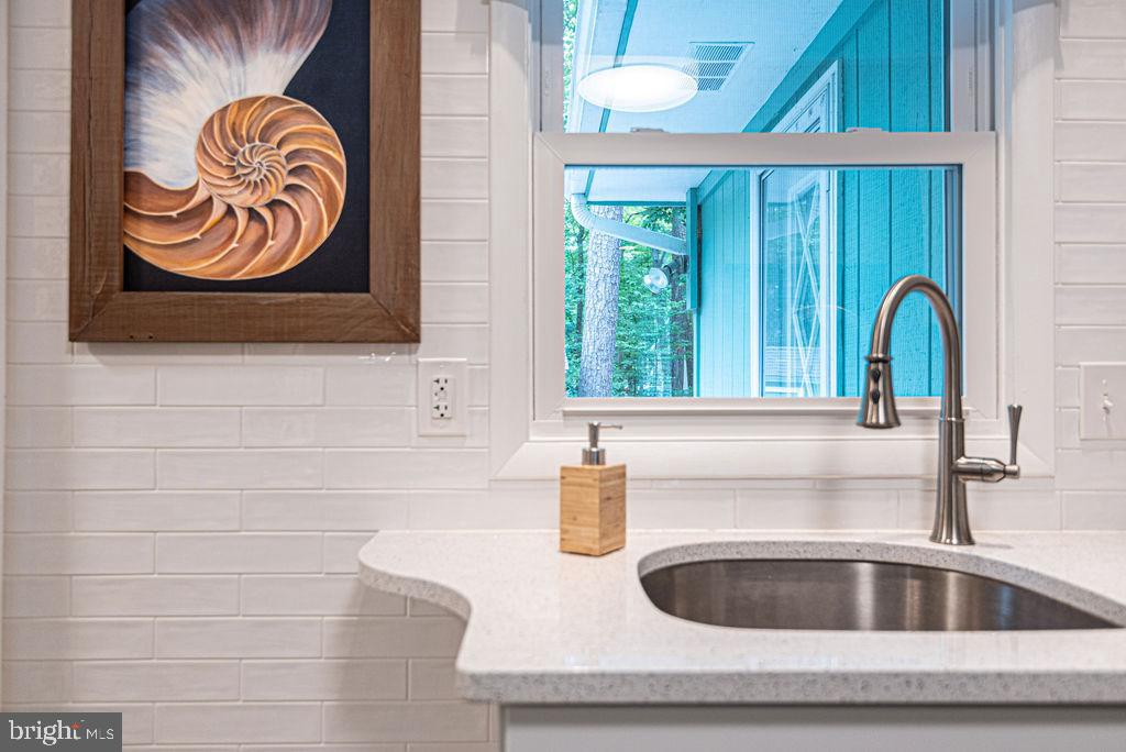 33 Falcon Bridge Road Ocean Pines, MD 21811 - Photo 27 of 71 a kitchen with a sink and a window