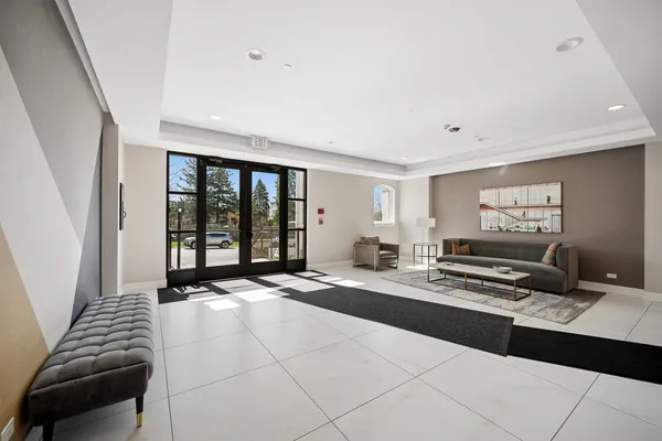 a living room with furniture and large window