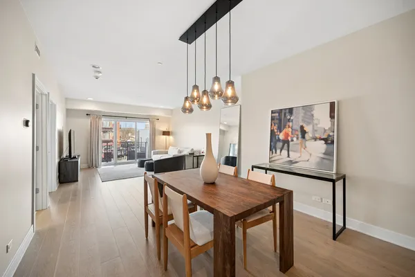 a view of a dining room with furniture window and wooden floor