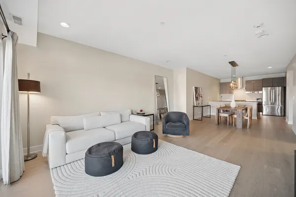 a living room with furniture and a table