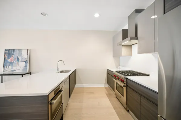 a kitchen with a stove and a sink