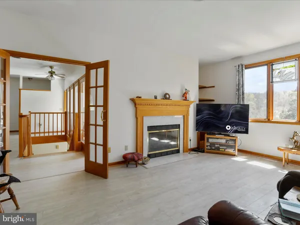 a view of livingroom with furniture and a fireplace