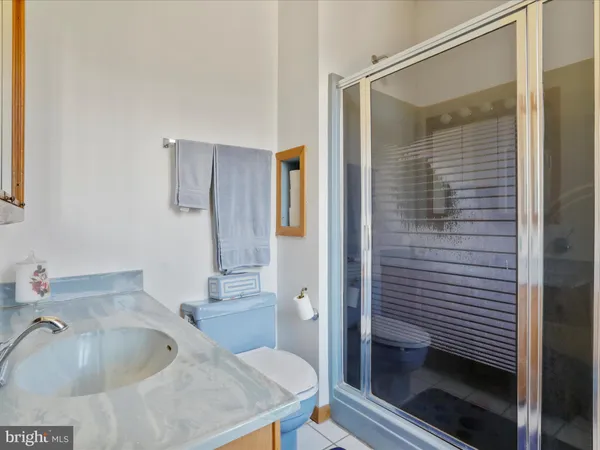 a bathroom with a sink and shower