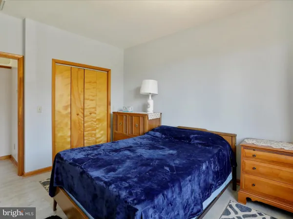 a view of room with wooden floor and cabinet