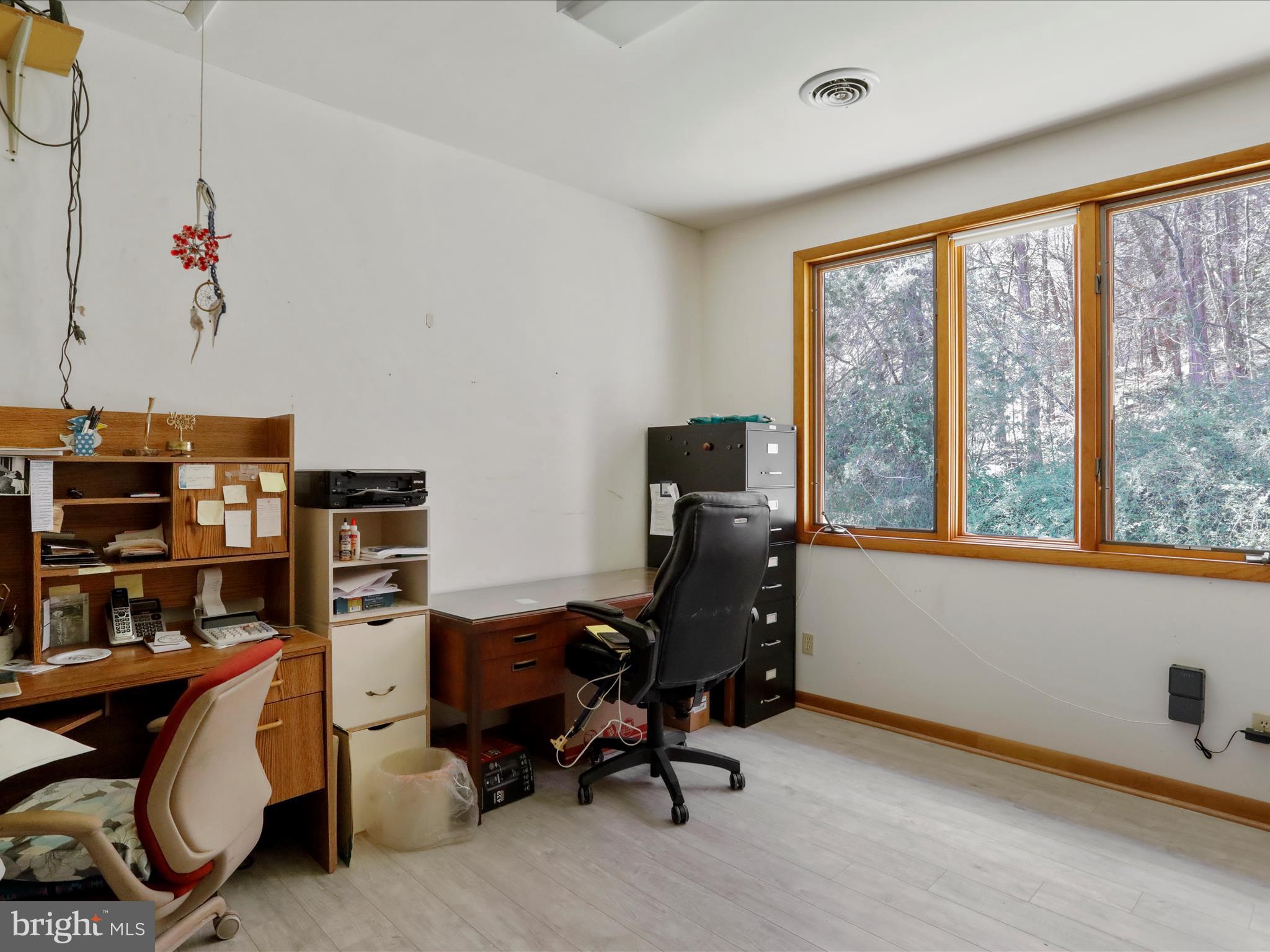 1639 Sugar Hill Road Maurertown, VA 22644 - Photo 37 of 57 a view of a workspace with furniture and a window
