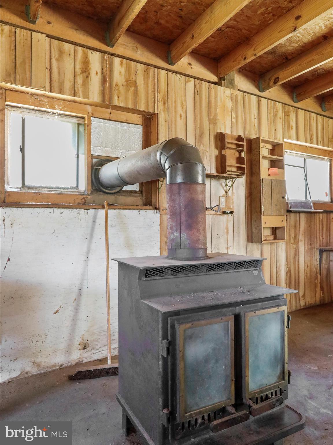 1639 Sugar Hill Road Maurertown, VA 22644 - Photo 42 of 57 Interior Barn / Workshop (wood stove)