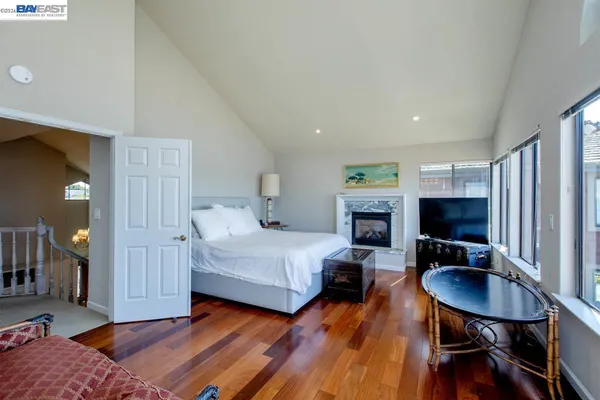 a bedroom with furniture and a window