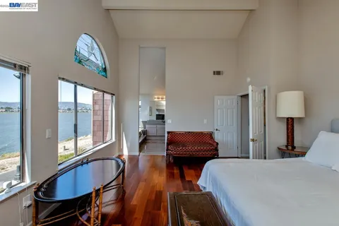 a room with furniture a flat screen tv and a fireplace