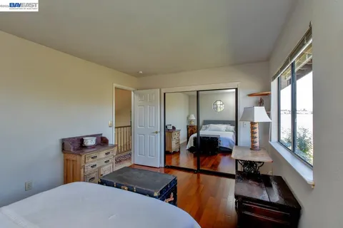 a view of a chair and table in backyard