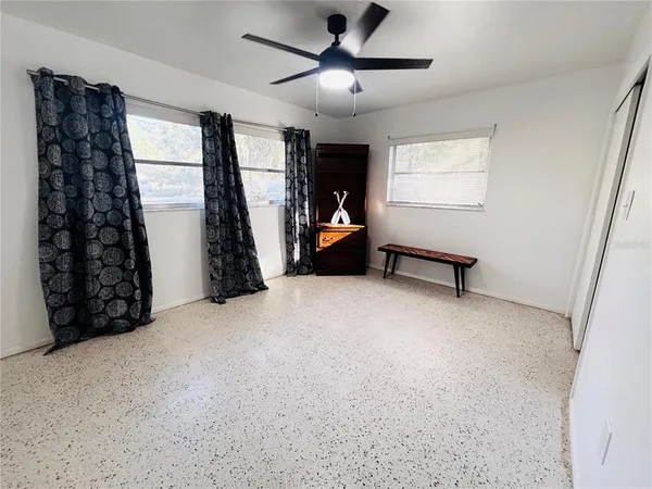 a bed room with furniture and a window
