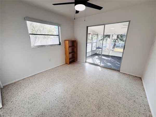 a view of an empty room with a window