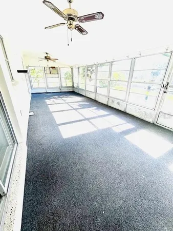 a view of a livingroom with furniture