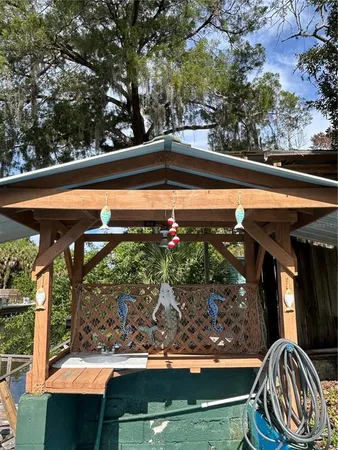 a view of a back yard of the house and a chair