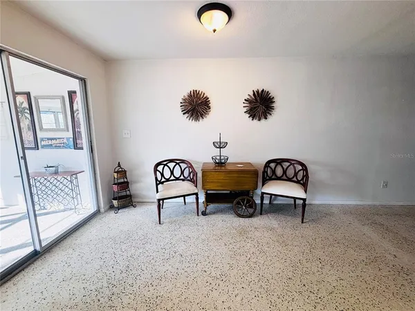 a view of living room with furniture and rug
