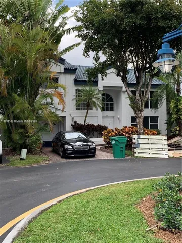 a car parked in front of a house
