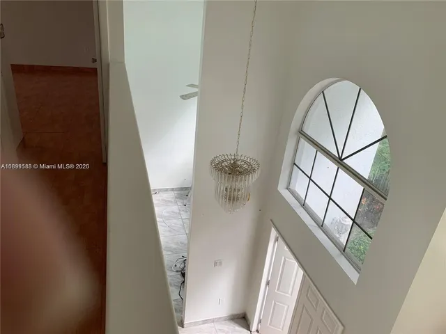 a view of empty room with windows