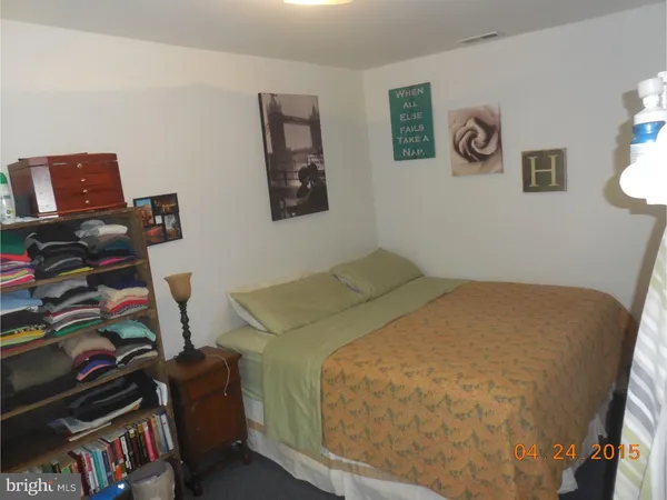 a bedroom with a bed and furniture