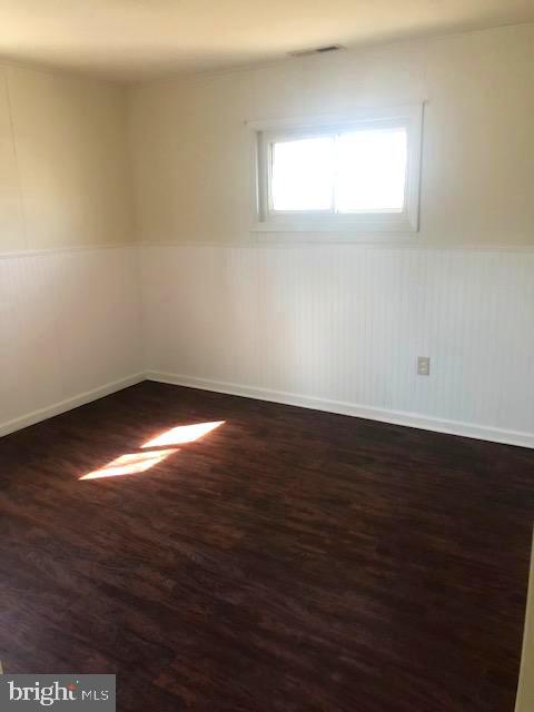 28 Violet Road Levittown, PA 19057 - Photo 12 of 16 an empty room with wooden floor and windows