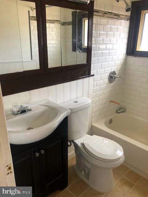 28 Violet Road Levittown, PA 19057 - Photo 7 of 16 a bathroom with a sink a toilet and shower