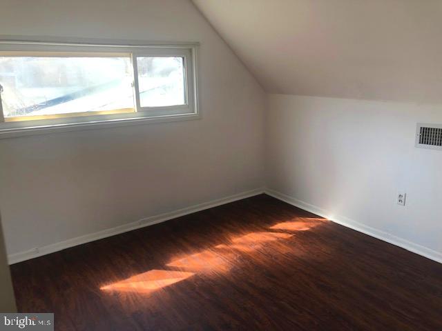28 Violet Road Levittown, PA 19057 - Photo 9 of 16 an empty room with wooden floor and windows