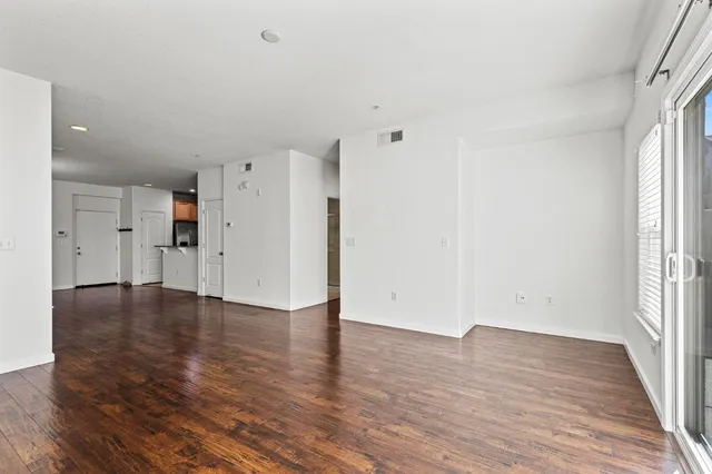 a bathroom with a toilet sink and a mirror