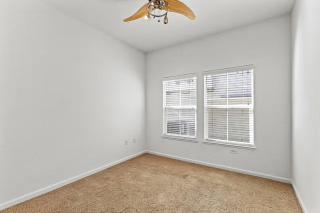 an empty room with closet area