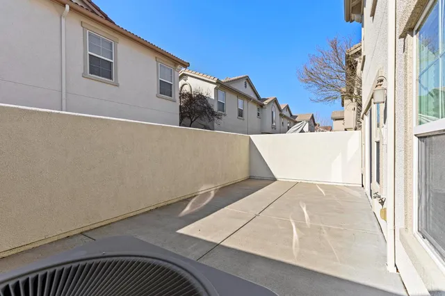 a view of a hallway to rooms