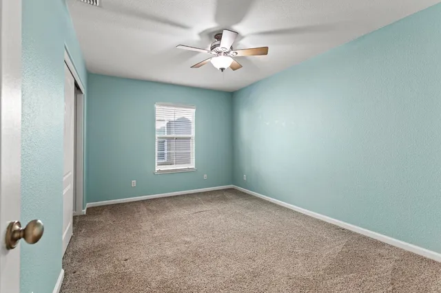 a bathroom with a toilet a sink and a mirror