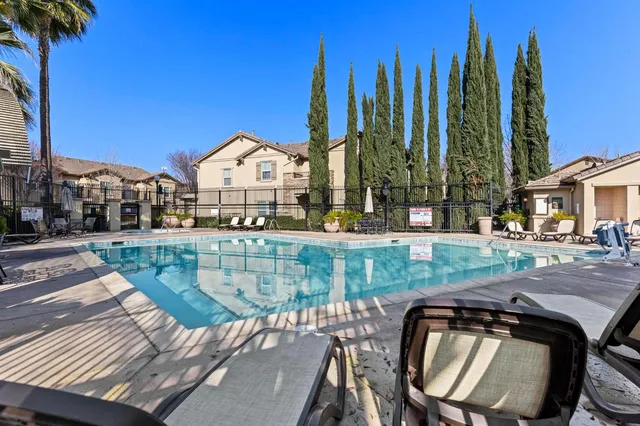 a view of outdoor space with playground and green space