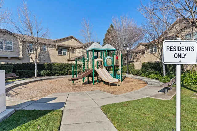 a street sign on a street next to a building