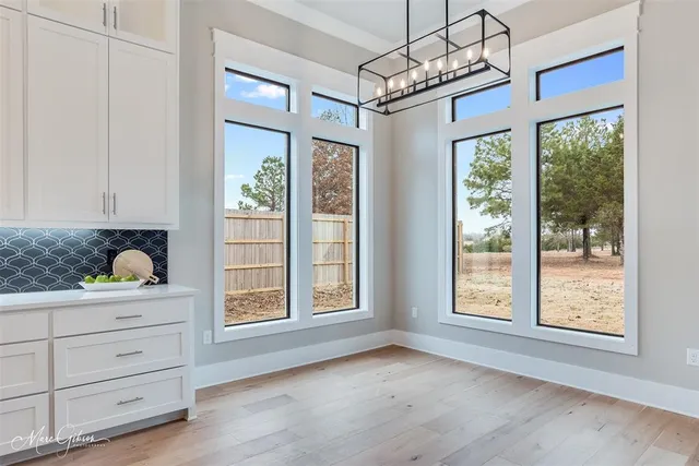 a view of livingroom with furniture window and wooden floor