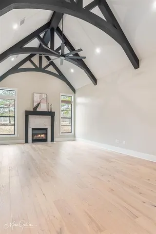 a view of an empty room and a fireplace