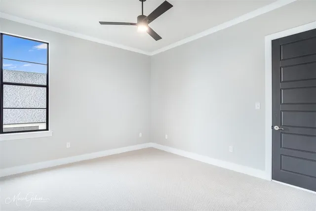 an empty room with a empty space and windows