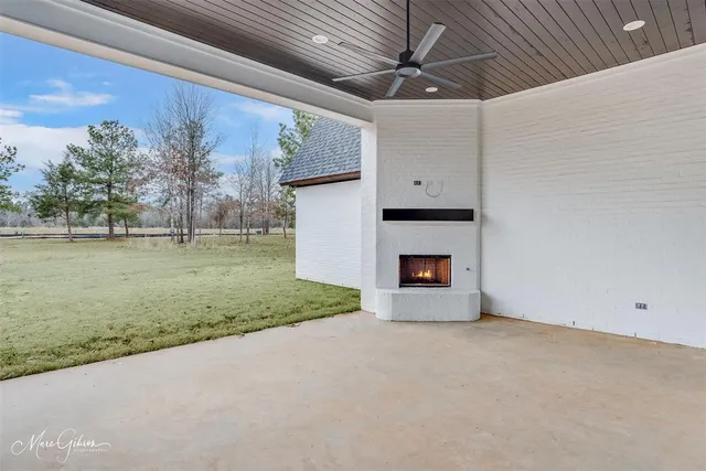 a view of a livingroom with a fireplace and a yard
