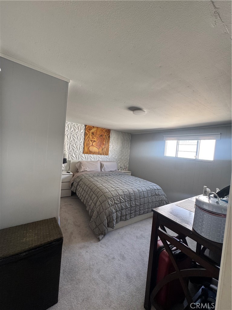 47 Fir Via Anaheim, CA 92801 - Photo 11 of 14 a bedroom with a bed and a dresser