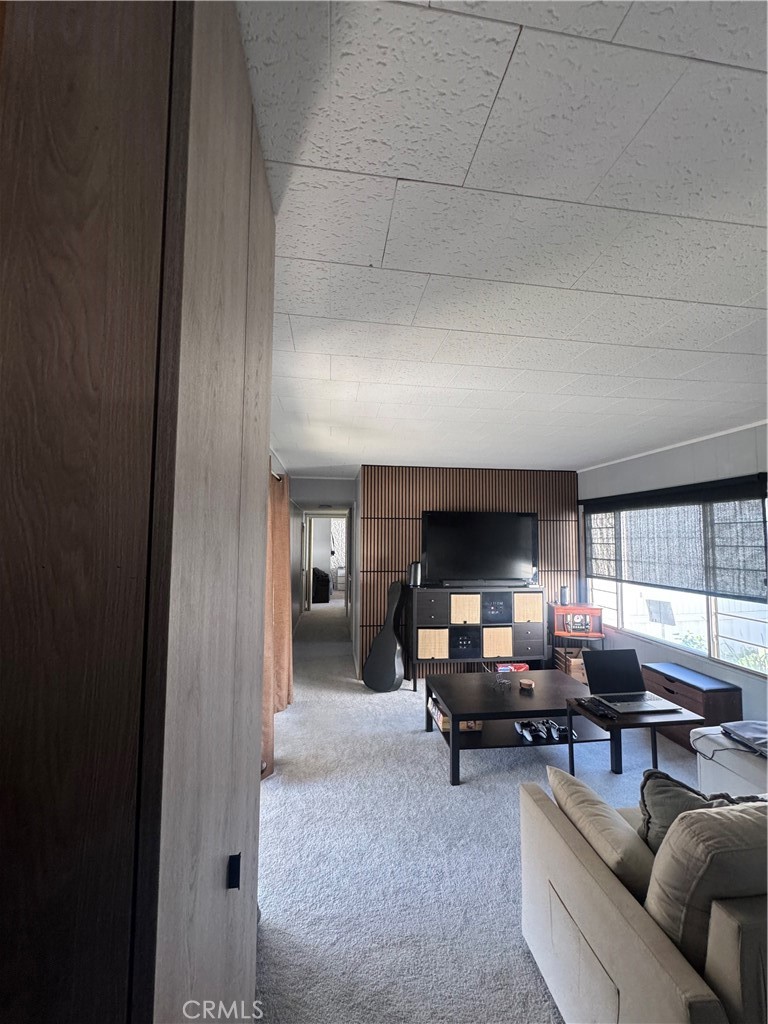 47 Fir Via Anaheim, CA 92801 - Photo 13 of 14 a living room with furniture and a fireplace