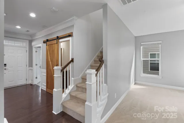a view of a room with window and wooden floor