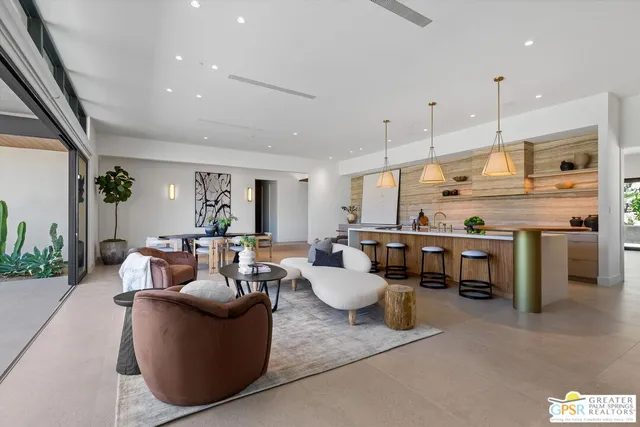 a view of a dinning table and chairs in the patio