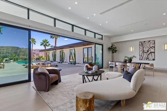 a bed sitting in front of a balcony
